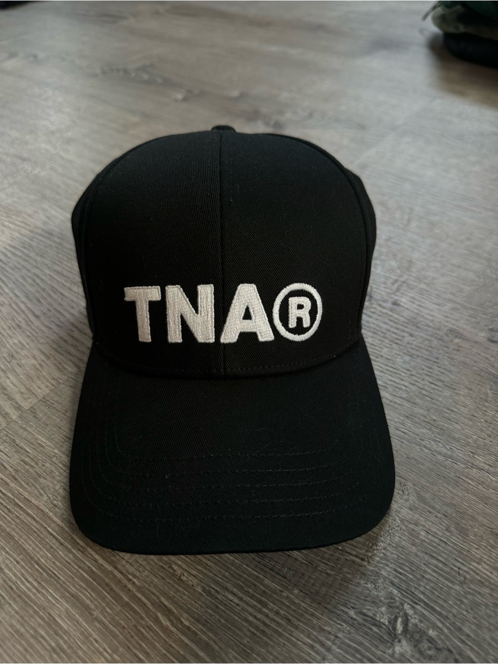 Aritzia Black Baseball Cap with White TNA® Embroidery